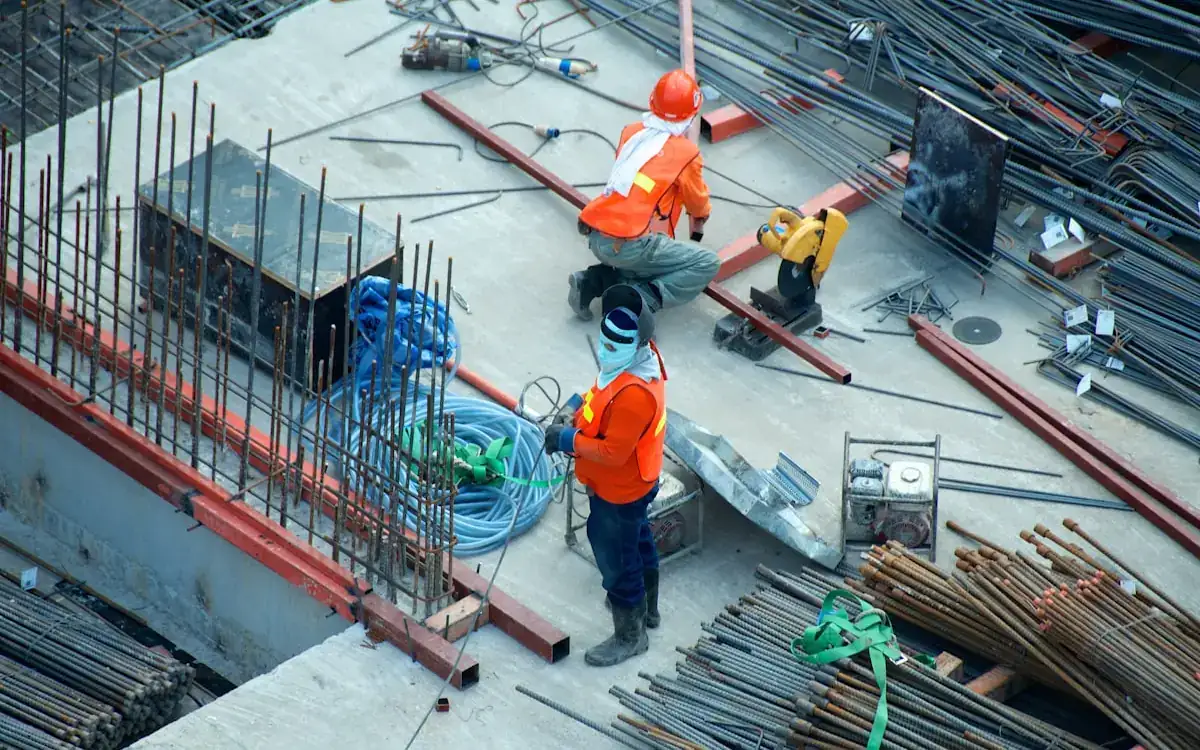 Construction site with workers and crane